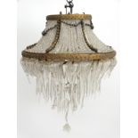 Mid Century Chandelier : a circular brass 3 tier hanging pendant light ,