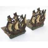 A pair of early - mid 20thC brass and painted cast iron bookends in the form of galleons.