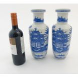 A pair of Chinese blue and white Rouleau vases,