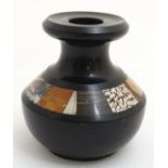 A c.1900 black slate vase with pietra dura inlay with specimen marble.