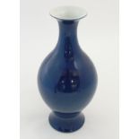 A Chinese blue monochrome vase with round bulbous body on flared foot / base,