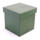 A 20thC green leather covered box approx 12"sq.