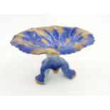 A Flow Blue Ironstone three footed Staffordshire tazza depicting flowers to plate with gilt