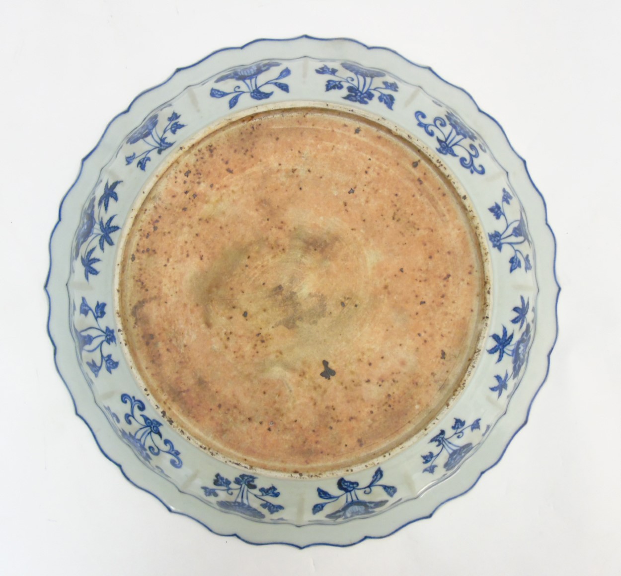 A Chinese blue and white 'Grape' dish / charger: A large Chinese charger with barbed rim, - Image 3 of 9