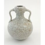 A Chinese double gourd Ge ware vase with ruyi shaped handles,