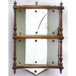 An early 20thC wooden wall mounted mirrored display shelf.