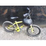 A child's yellow BMX bike and helmet This lot is being sold for our nominated charity for the