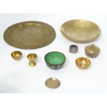 A collection of oriental & Indian metal ware to include candle stick, chargers,