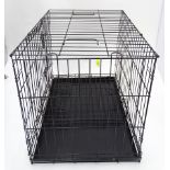 A black metal collapsible dog cage size 21" x 30" x 24" high CONDITION: Please Note