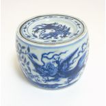 A Chinese blue and white cricket jar and cover decorated in underglaze blue depicting 4 clawed