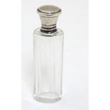 A glass scent / salts bottle with silver top hallmarked 1928 maker Walker & Hall 3 1/8" high