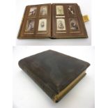 A late Victorian photograph leather bound photograph album containing a number of sepia portrait