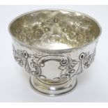 A silver pedestal rose bowl with embossed decoration, hallmarked Birmingham 1903 maker Thomas Hayes.