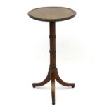 An early / mid 19thC mahogany tripod table with moulded reeded circular top,