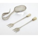 A pair of silver small pickle forks with mother of pearl handle,