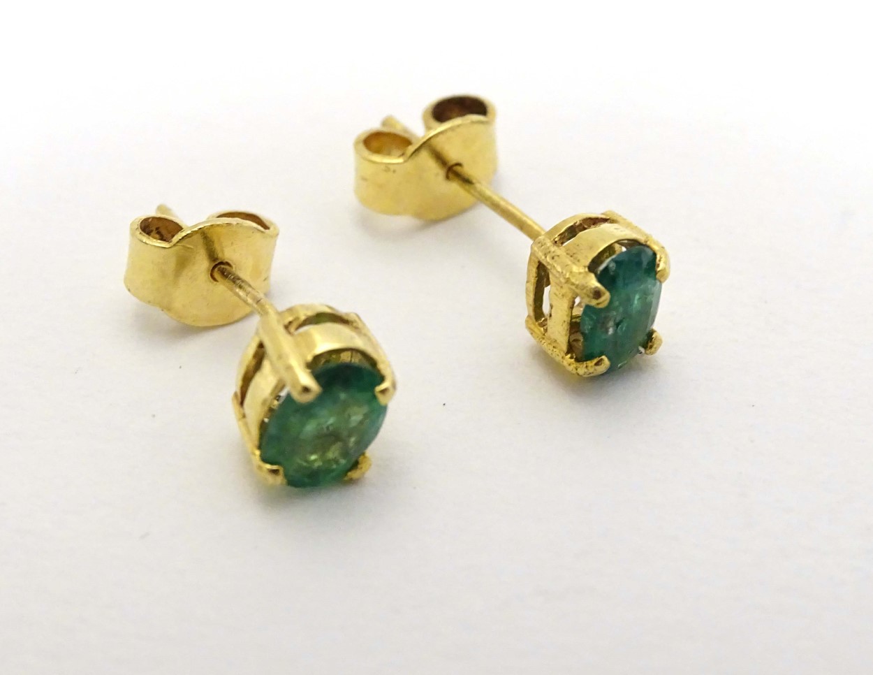 A pair of 9ct gold earrings set with emerald green stones CONDITION: Please Note - - Image 3 of 5