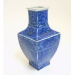 A Chinese blue and white square section vase, with archaic style decoration ,