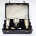 A silver 3 -piece cruet set comprising salt and pepper pots and mustard pot hallmarked Sheffield