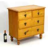 A Victorian pine chest of drawers comprising two short over two long drawers,