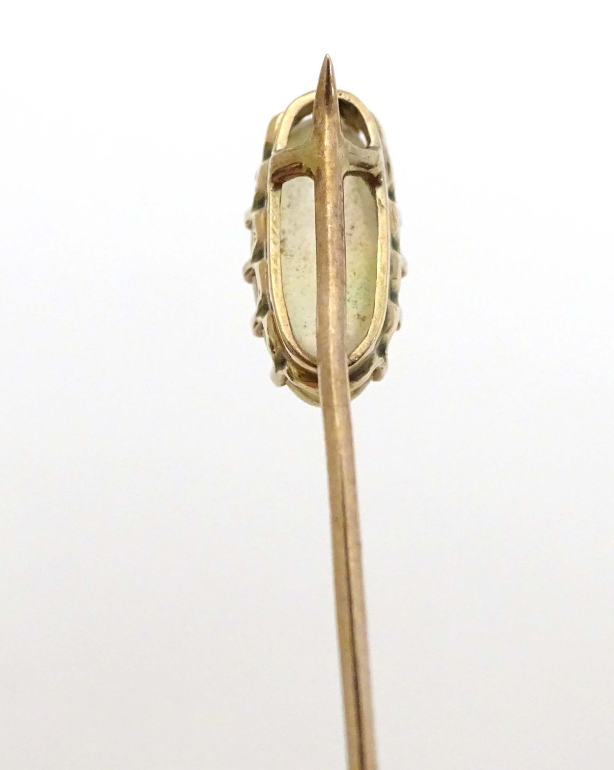 A yellow metal stick pin surmounted by moonstone cabochon 2 1/2" long CONDITION: - Image 2 of 4