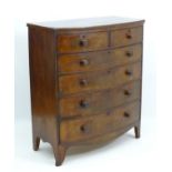 A mid 19thC mahogany chest of drawers comprising two short over four long drawers,