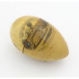 Mauchline ware : A Turned treen needlework thimble case of egg form,