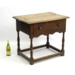 A 17 thC oak side table with deep drawer , slim turned baluster supports ,