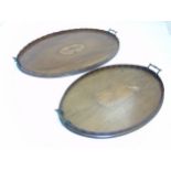 Two Georgian oval butler trays, one inlaid with urn detail, the other with fan shape detail.