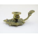 A 19thC Rococo style small proportion brass chamberstick 3 1/2" long CONDITION: