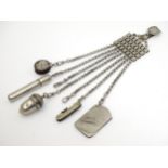 A nickel and silver plate Chatelaine with various items to include penknife, aide-memoire,