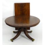 A late 19thC mahogany extending dining table,