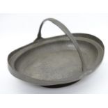 Arts and Crafts : a hammered ( plannished ) pewter cake basket by Lion Pewter ,