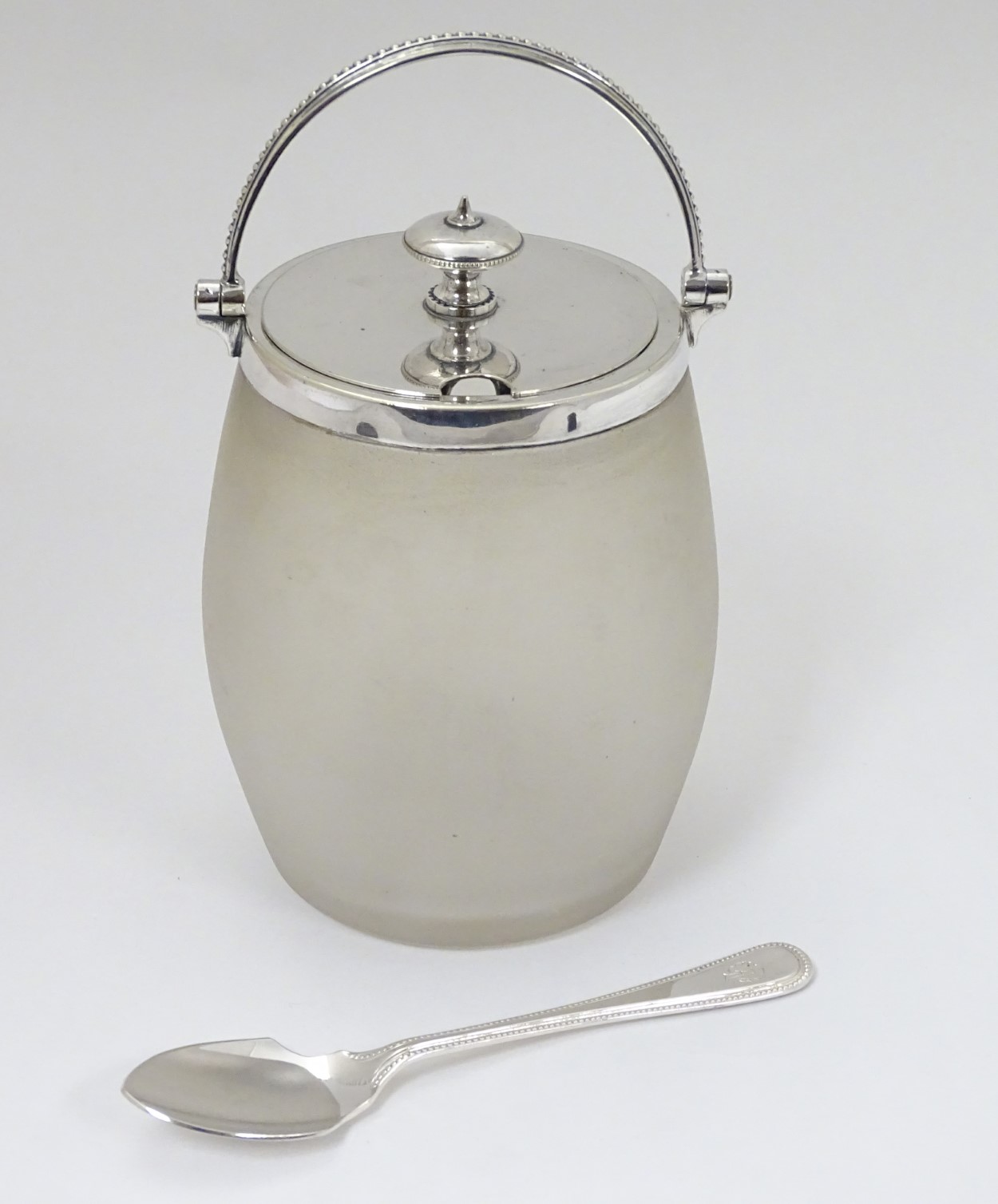 A glass preserve / jam pot with silver plate mounts lid and handle 6 1/2" high overall.