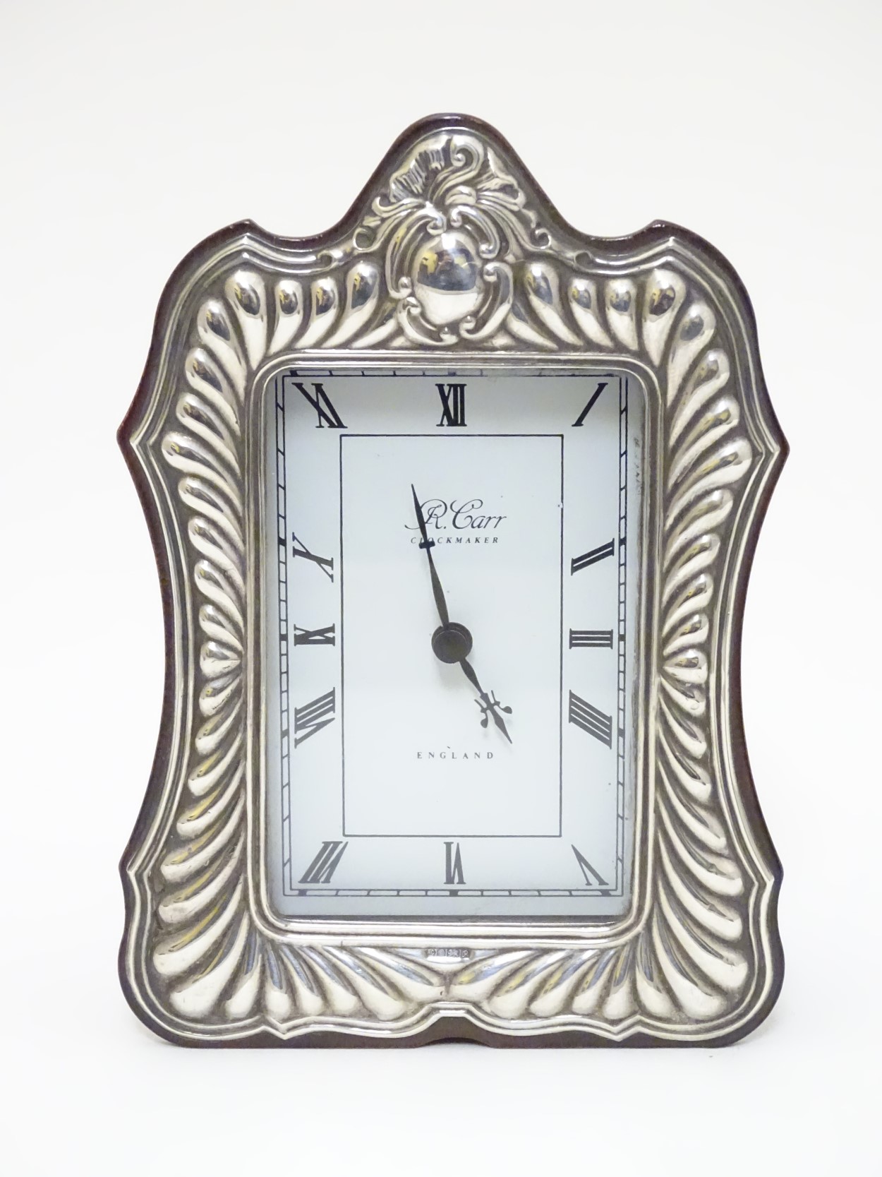 A small wooden cased mantle clock with silver surround hallmarked Sheffield 1989 maker Carrs of