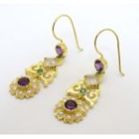 A pair of silver gilt drop earrings set with pearls, purple and green stones.