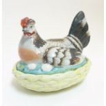 A 19thC Staffordshire hen on nest tureen with yellow basket,