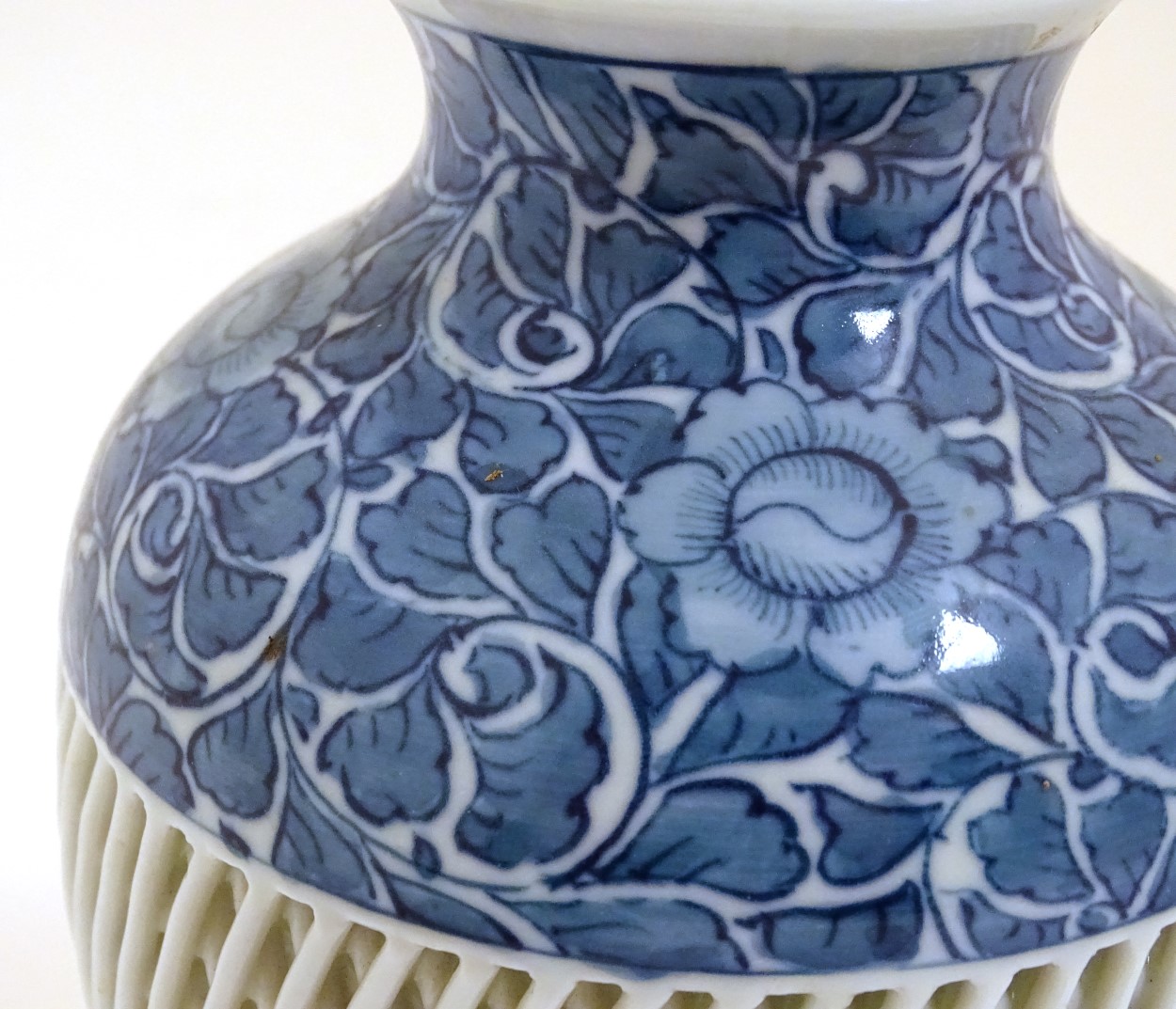 A blue and white Chinese baluster vase decorated with a floral pattern and a reticulated banded - Image 2 of 11