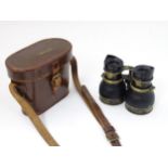 Militaria : A cased pair of WWII RAF binoculars, of brass construction with blackout finish,