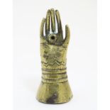 A Novelety Victorian brass go-to-bed in the form of an Elizabethan hand and cuff 2 7/8"