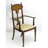 Glasgow School : An Art Nouveau inlaid mahogany chair with open arms ,
