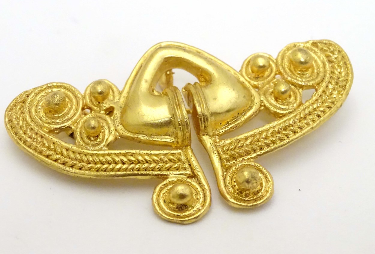 A gilt brooch of abstract form marked to reverse REU. - Image 3 of 6