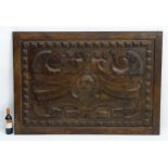 A late 17thC / early 18thC French chestnut panel, with relief carved decoration,