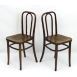 A pair of Thonet bentwood chairs with curved top rail and backsplat,