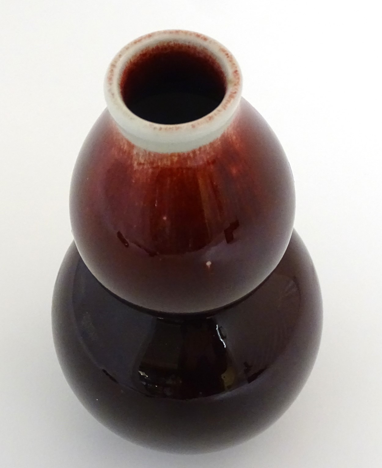 A Chinese sang-de-boeuf double gourd, high fired porcelain vase. Indistinct Chinese marking to base. - Image 2 of 10