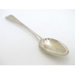 A table spoon hallmarked London 1772 maker Stephen Adams 8" long.
