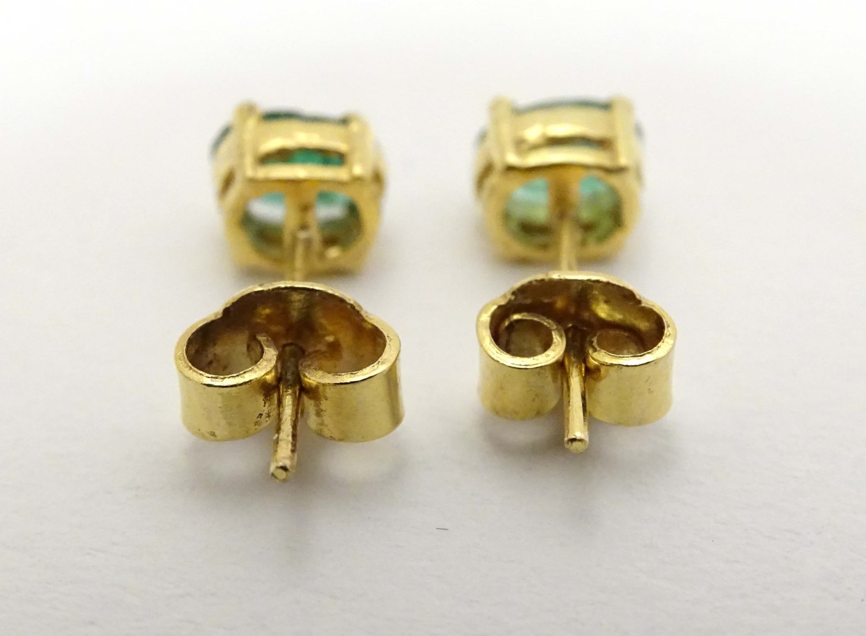 A pair of 9ct gold earrings set with emerald green stones CONDITION: Please Note - - Image 5 of 5