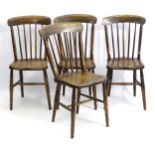 A set of four late 19thC / early 20thC elm seated windsor dining chairs,