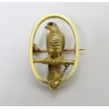 A 15ct gold brooch of oval form with falcon bird to centre 1 1/4" high CONDITION: