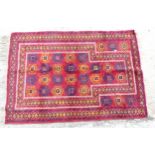 Rug / carpet : A hand made prayer mat , with 26 central motifs and 3+3 outer motifs ,