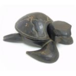 An African carved and stained wooden turtle with shell removing to reveal recess within 11 1/2"